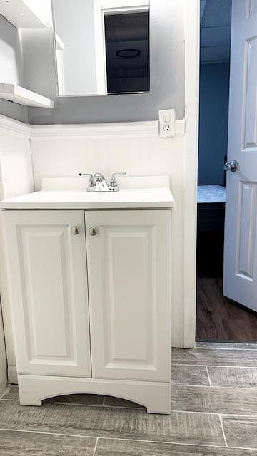 Full bathroom with shower that is shared with Room 5