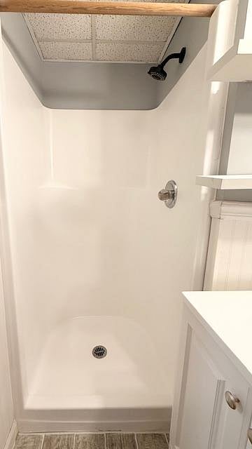 Full bathroom with shower that is shared with Room 5