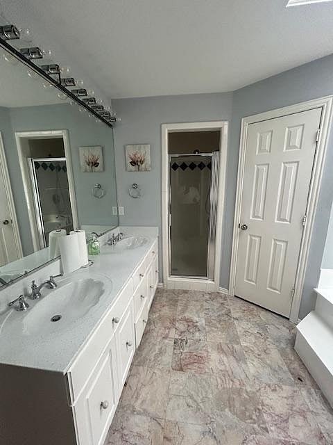 Private master suite shower and walk-in closet.