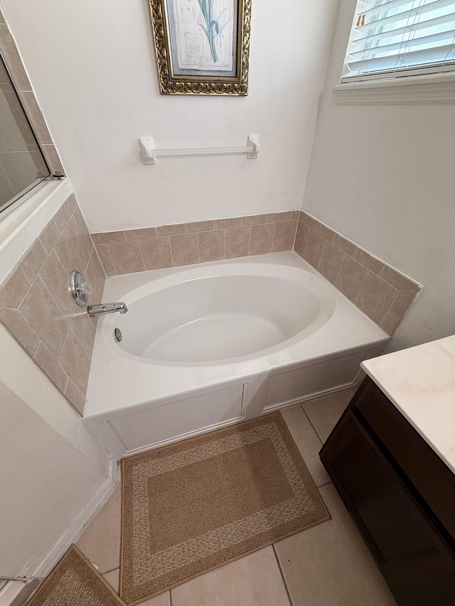 Spacious Master Bathroom with Double Vanity, Soaking Tub & Stand-Up Shower