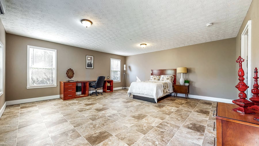 Huge spacious bedroom, Full bed, Dresser, Desk, Chair, Lamp, Door to patio