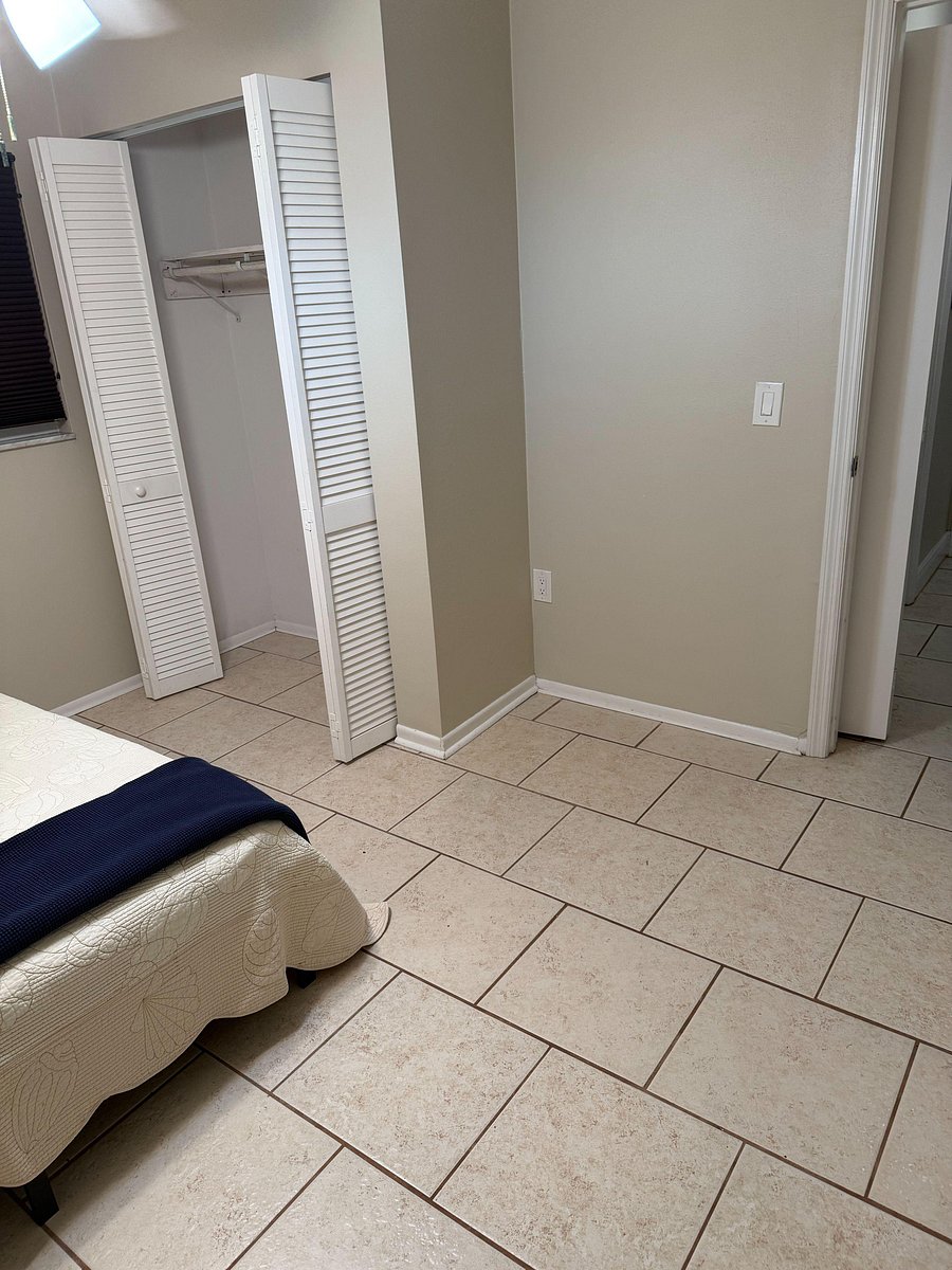 located at the end of the hall next to the bathroom