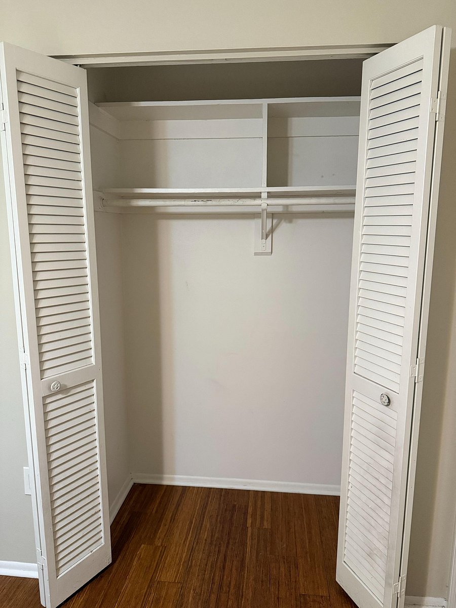 Reach in closet with shelf and clothing rod