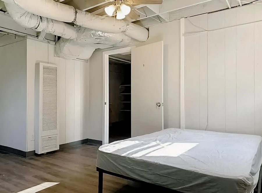 Oversized room with dual windows and a ceiling fan!
