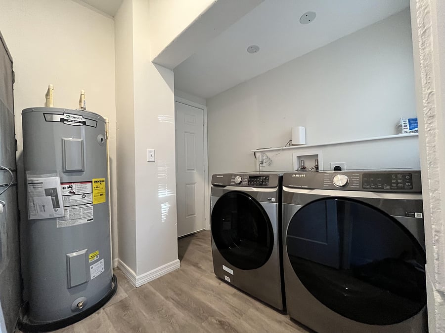Laundry room with brand new washer/dryer units