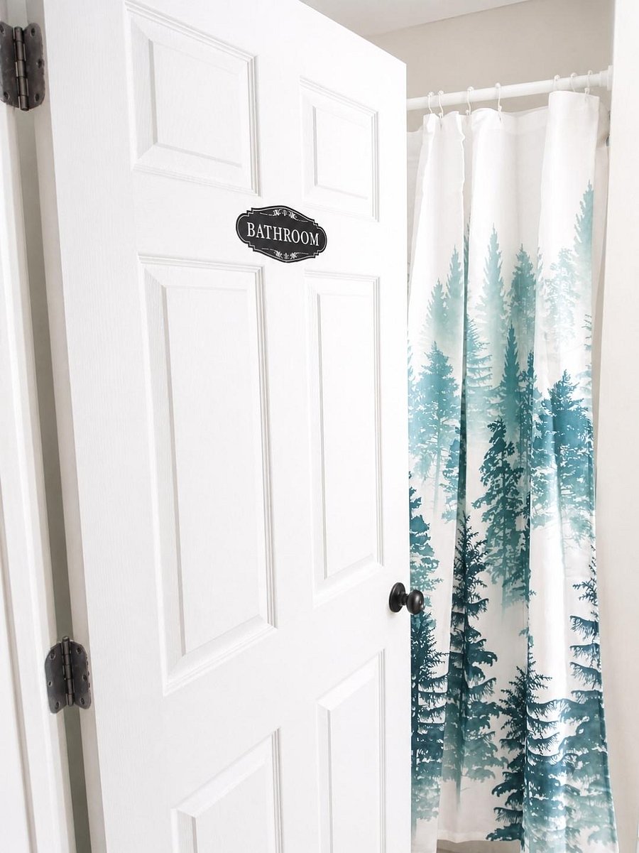 Full bathroom with a shower/tub combo and curtain, offering a convenient setup for daily use.