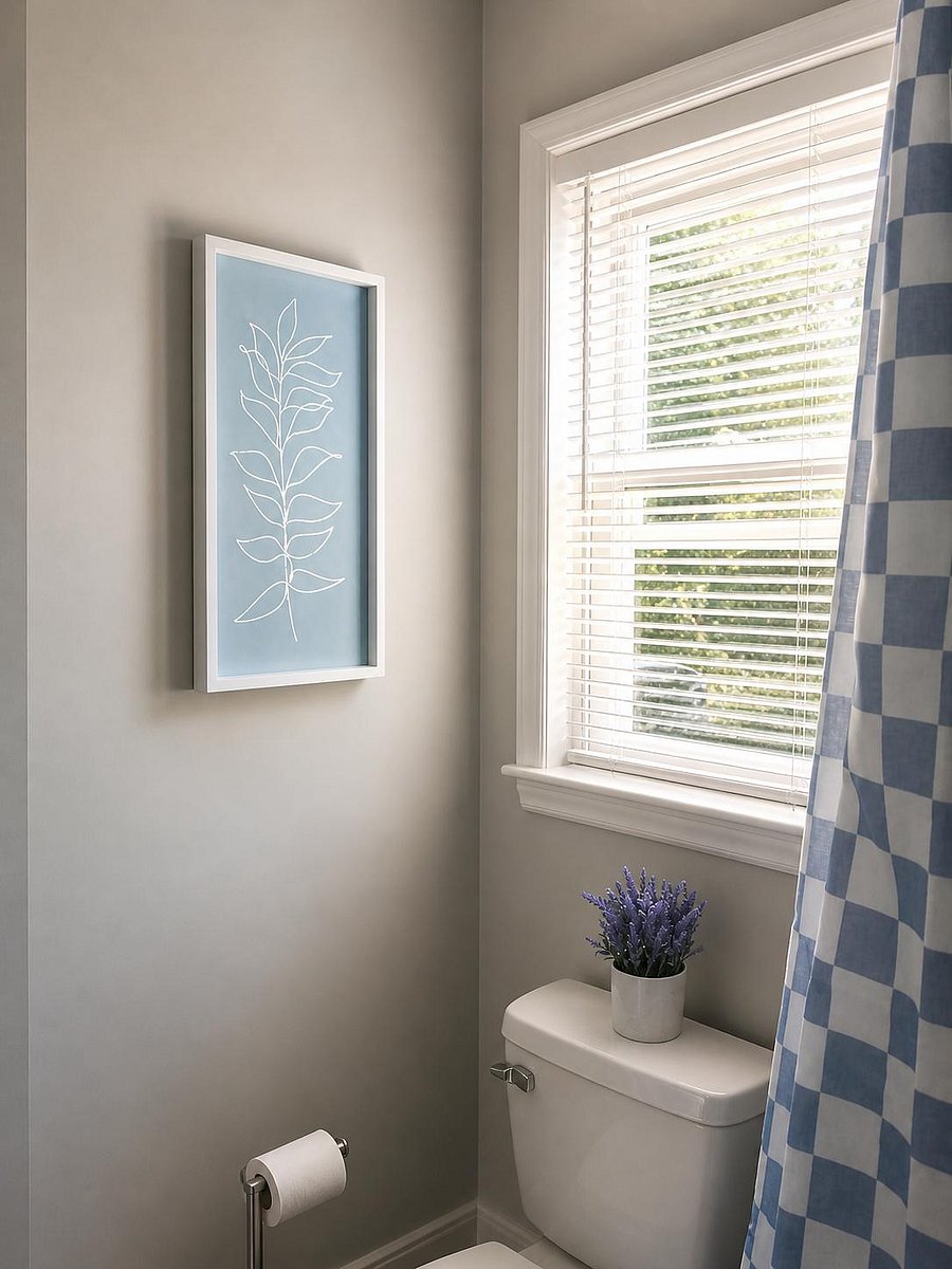 Bathroom features a window with blinds, neutral paint, and a shower/tub with curtain for easy everyday use.