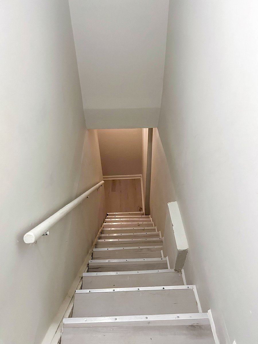 Stairs to downstairs bedrooms