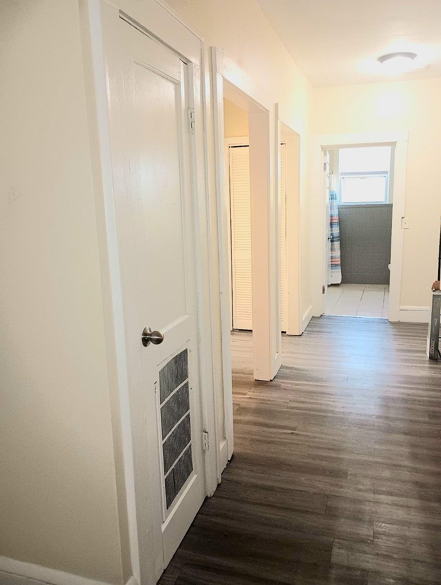 Large and long hallway with seating area to relax.