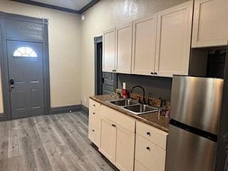 Living Room Area with sink and 2nd Refrigerator