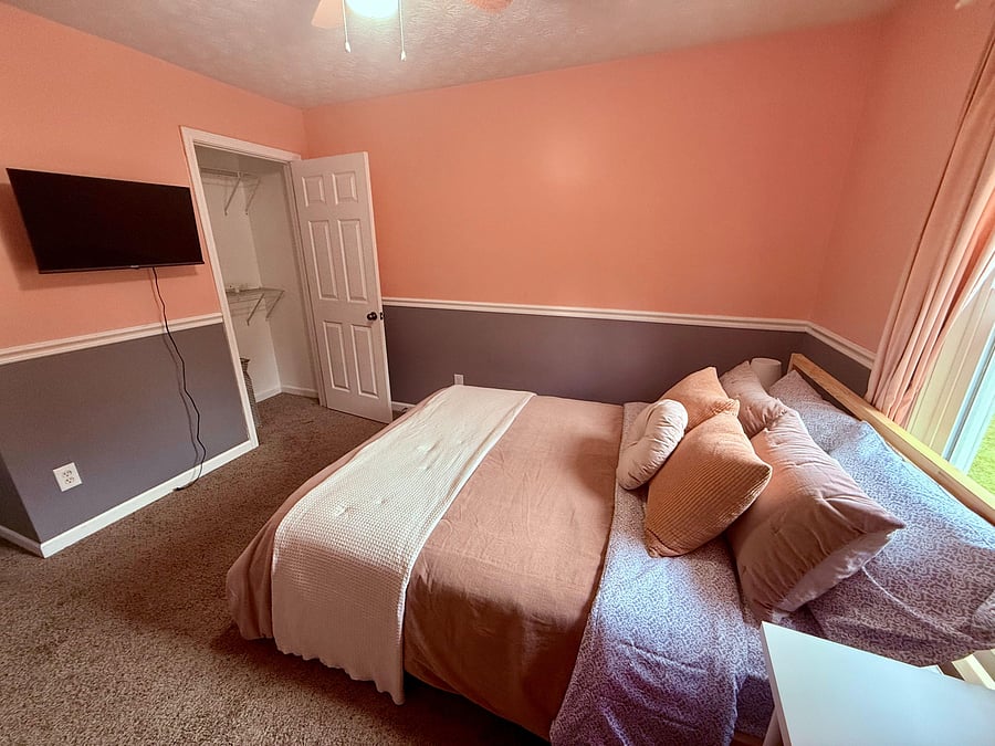 Cozy second-floor bedroom with natural light