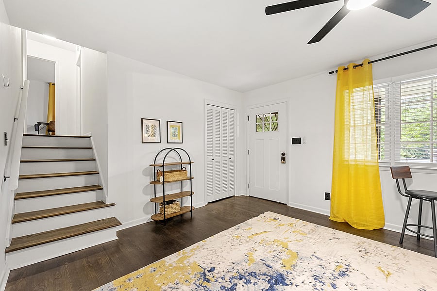 Stairs to bedrooms off living room