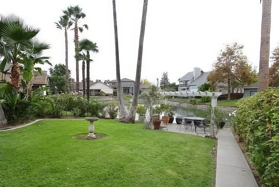 Grounds include rose gardens on the walk to the lake.