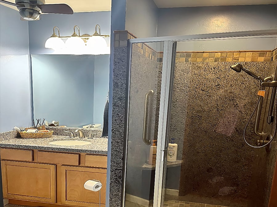 Ensuite Bathroom: Private, attached bath with walk-in shower and granite vanity