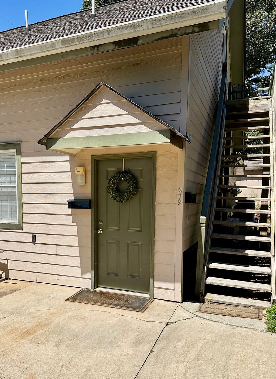 Front door.  Owners gladly accept package deliveries for you. 