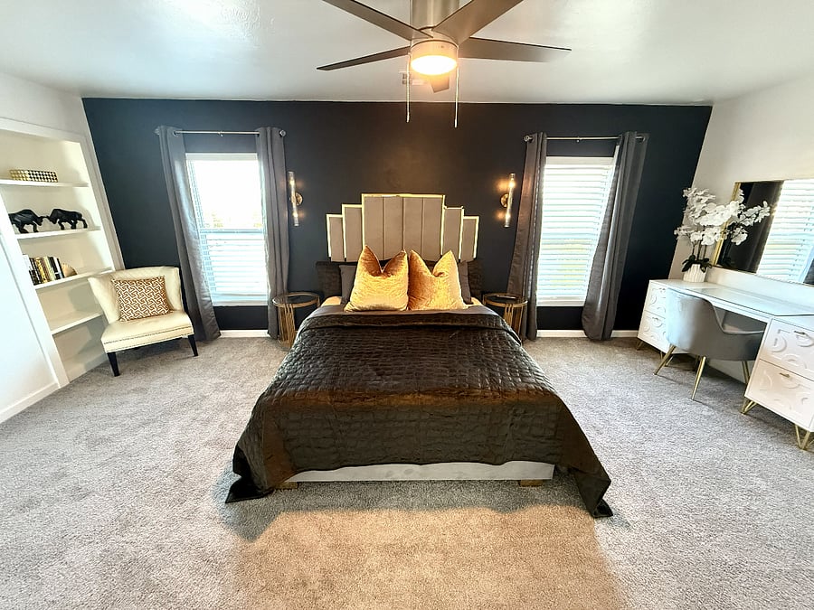 Master Bedroom - 1 Queen Size Bed, En-Suite Full Bathroom, 2 Walk-In Closets, Reading Area, 1 65 Inch Smart TV, & Ceiling Fan