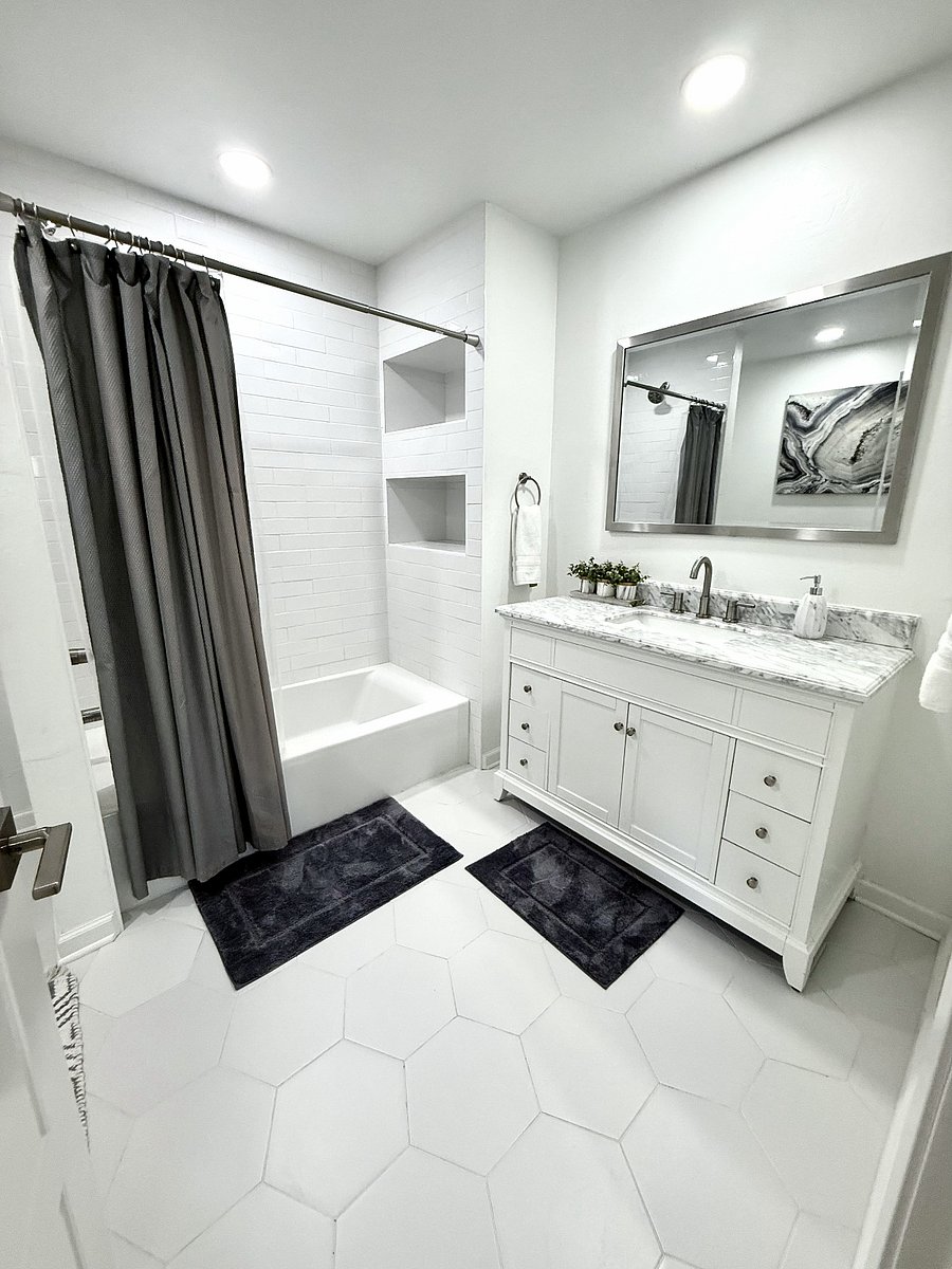 Over-sized Full Bathroom Upstairs with Tub/Shower Combo. Shared by both upstairs secondary bedrooms