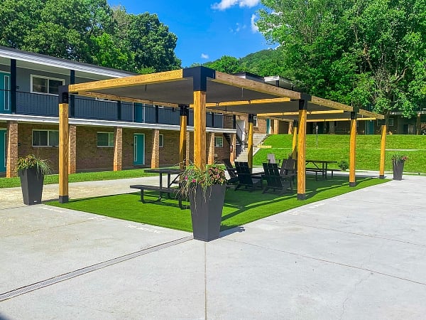 Beautiful courtyard with a pergola and quality outdoor furniture