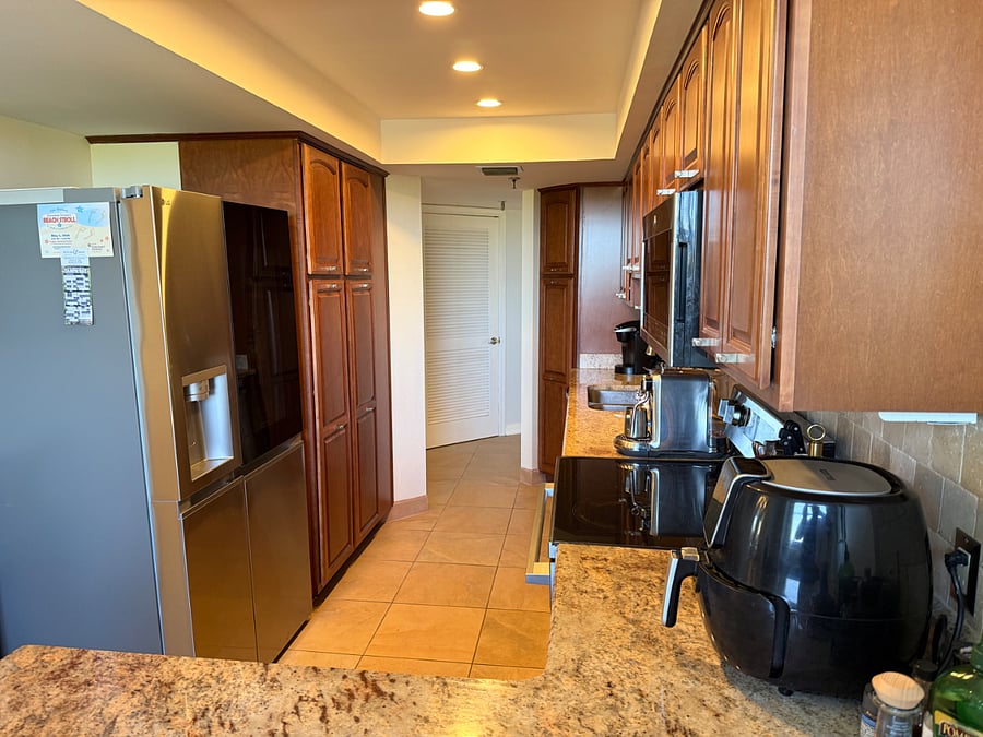 This kitchen has a counter top air fryer and an oven air fryer as well. The Fridge as make craft ball ice cubes for your cocktails.