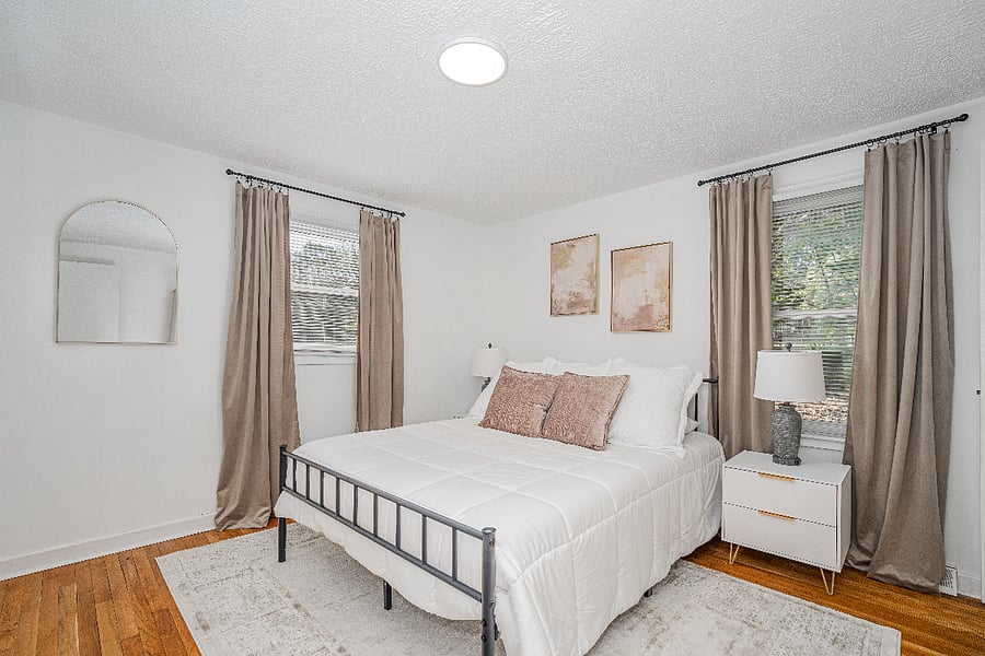 Primary queen bedroom suite with half bath