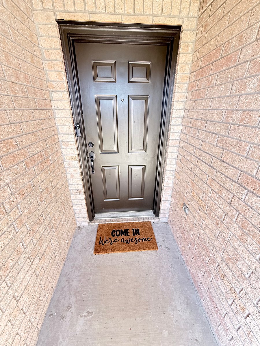 Front door view with Blink doorbell and online service. 