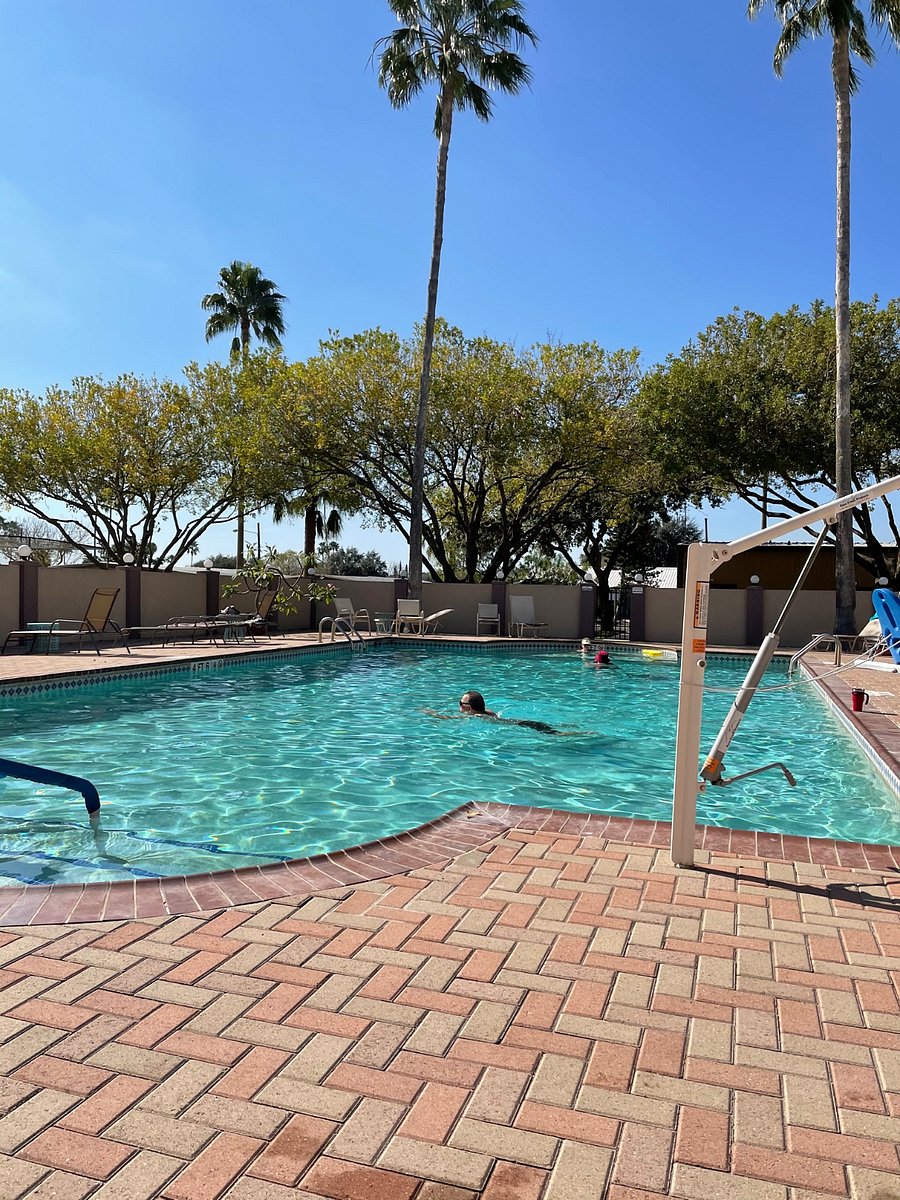 Large, heated therapy pool, plenty of lounge chairs, and hot tub to enjoy!