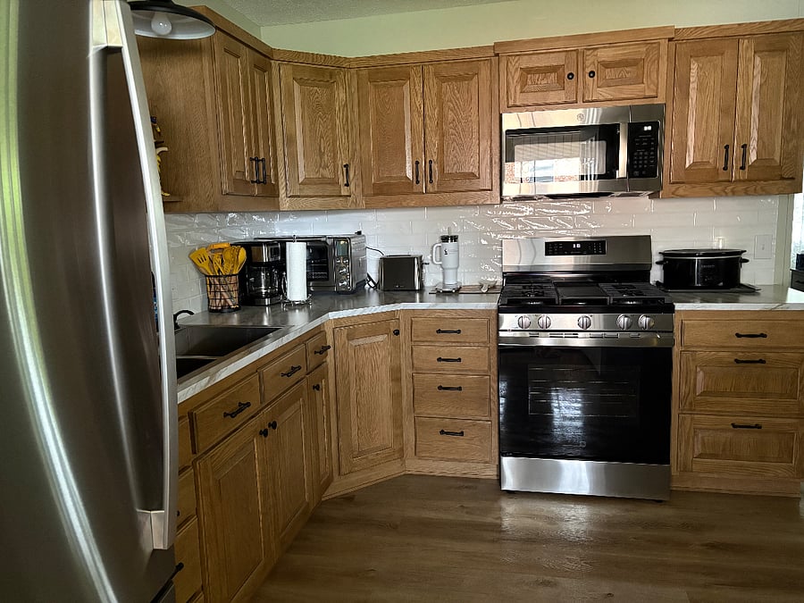 Whirlpool gas range with microwave vent above.
Breville toaster oven, coffee maker, toaster.