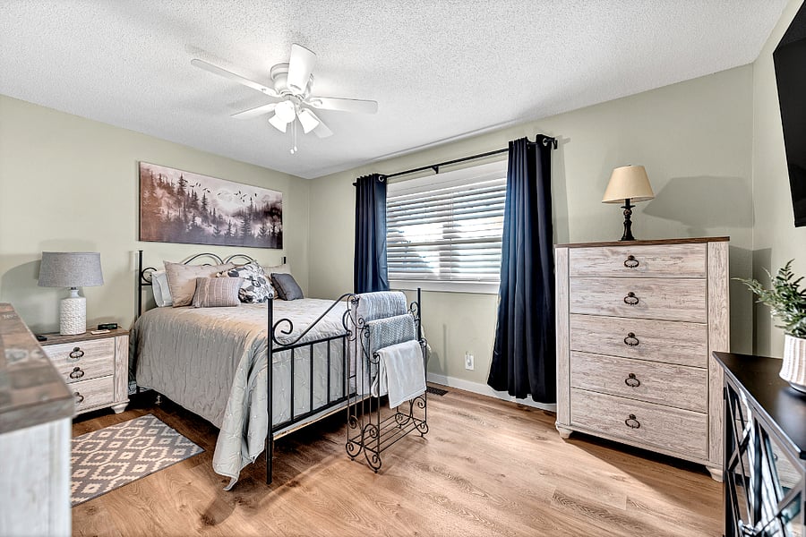 Room darkening shades over faux wood blinds gives daytime sleepers comfort.