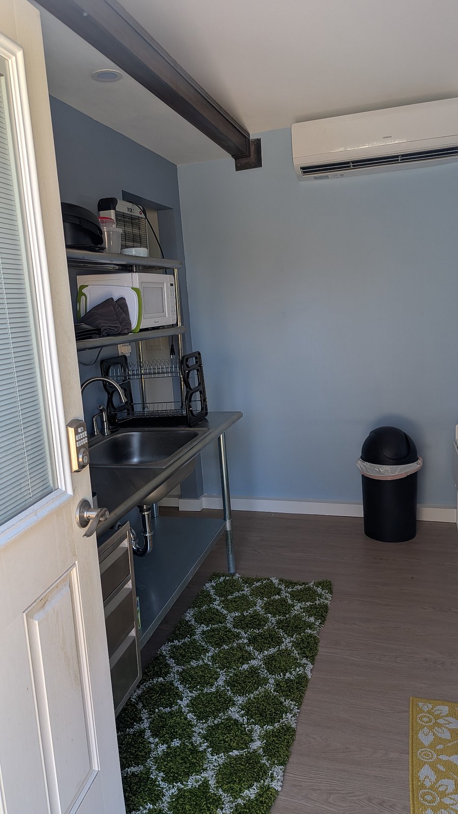 This is the corner of the kitchenette. As you turn into the bathroom. There is not a bathroom door.