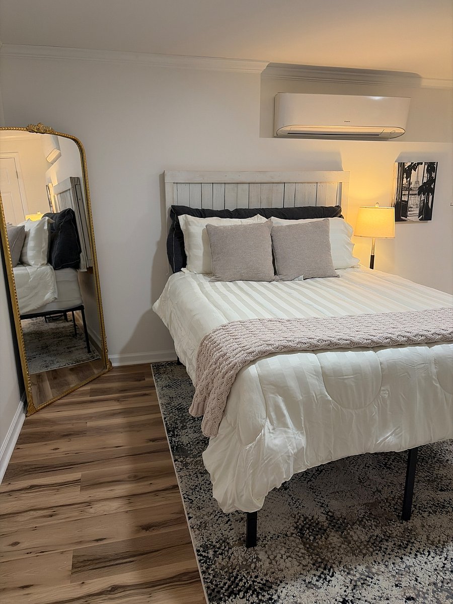 Spacious, main comfortable bedroom with premium bedding
