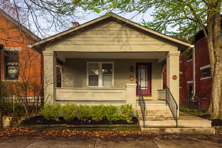 Covered porch looks out on tree-lined road in central German Village