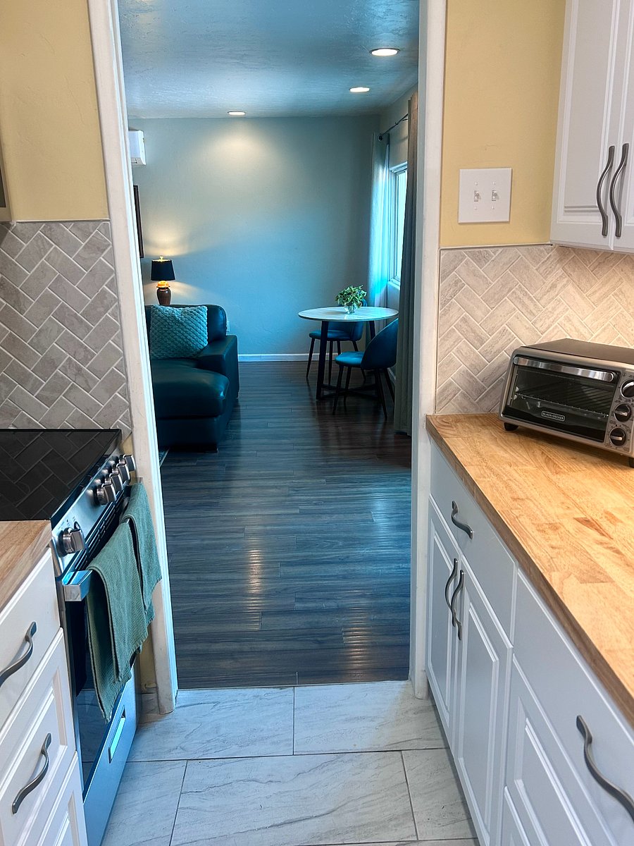 Well-appointed galley kitchen with open flow into living space, designed for efficient and comfortable everyday living