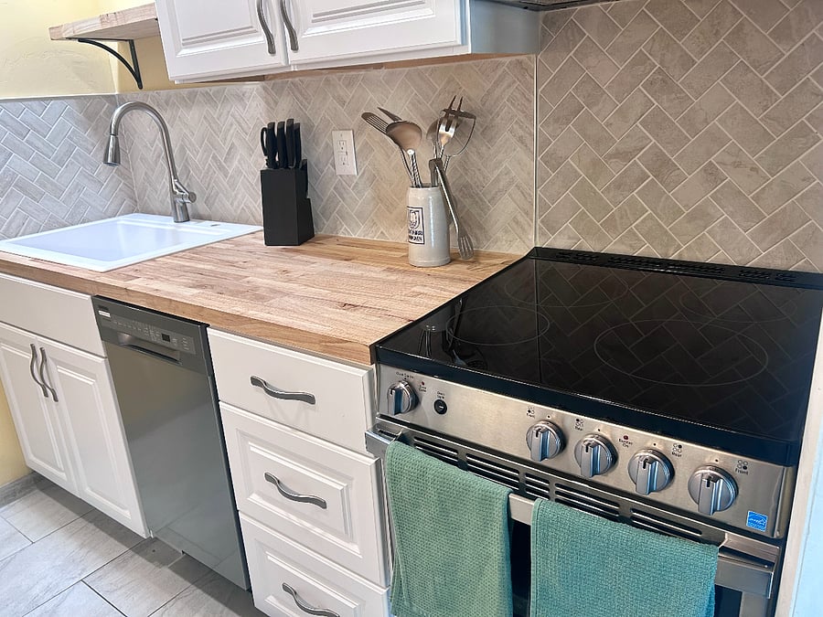 Efficient kitchen layout with generous prep space, coffee maker, and essentials for convenient daily living