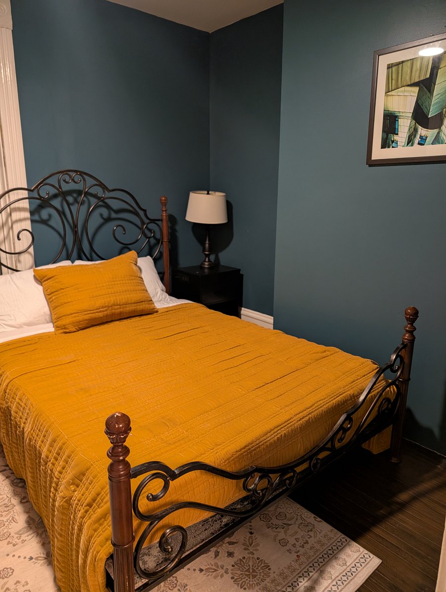 Main level, full-sized bedroom and workspace.
