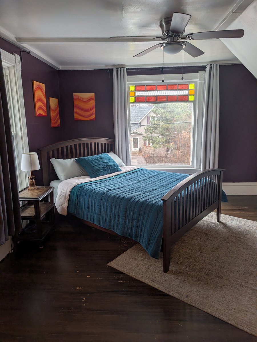 Main level, queen-sized bedroom. Beautifully restored, original stained-glass windows.