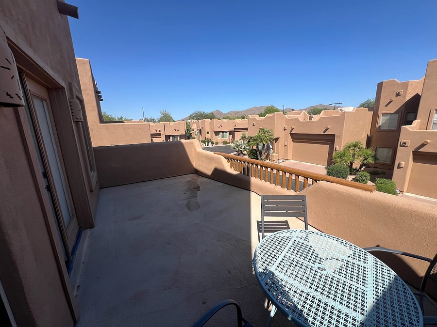 upper level suite 2 with balcony and view of mountains