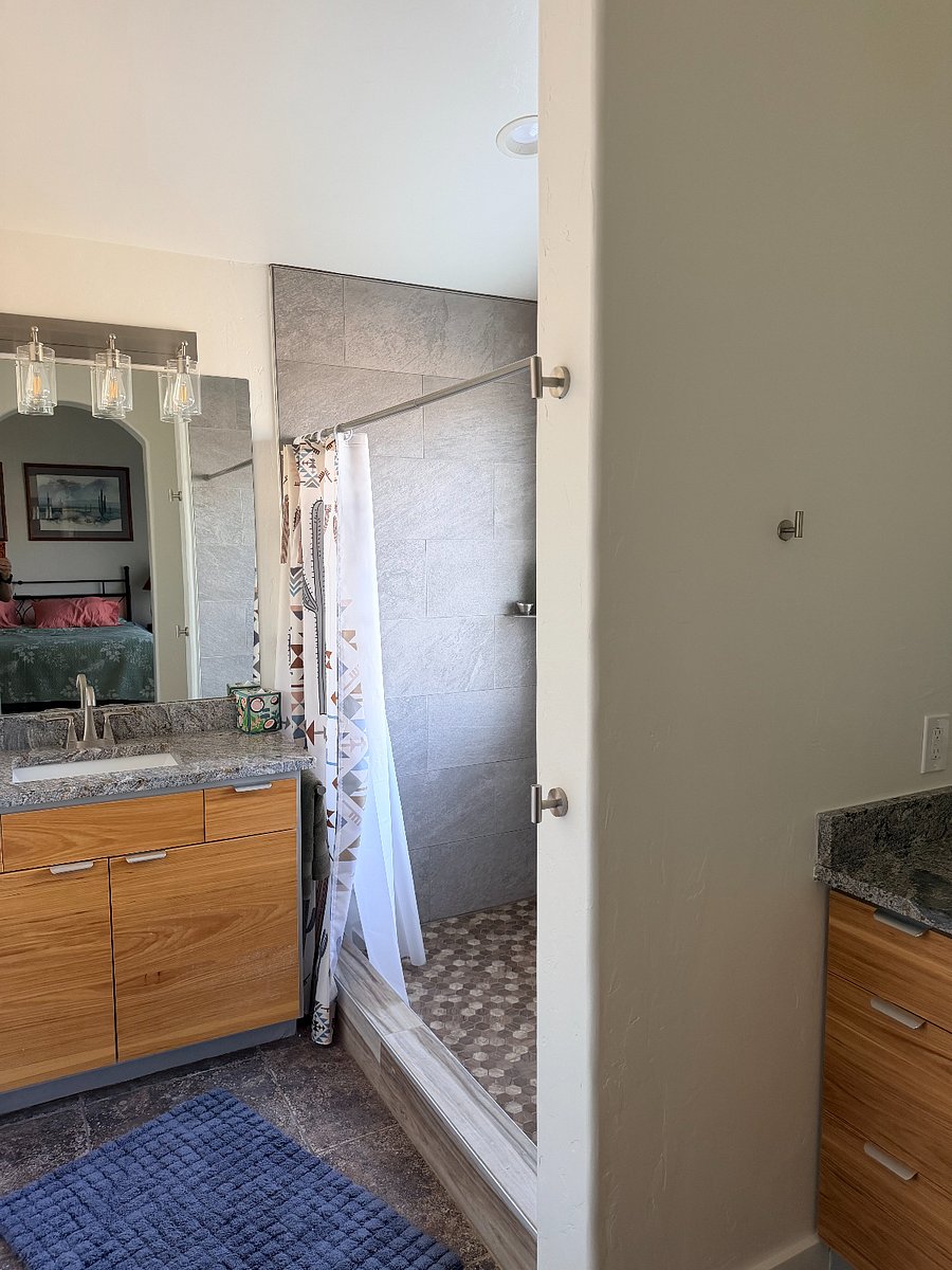 Master bath features separate water closet w bidet, 2 separate sinks, large tiled walk-in shower, AND a generous walk-in closet