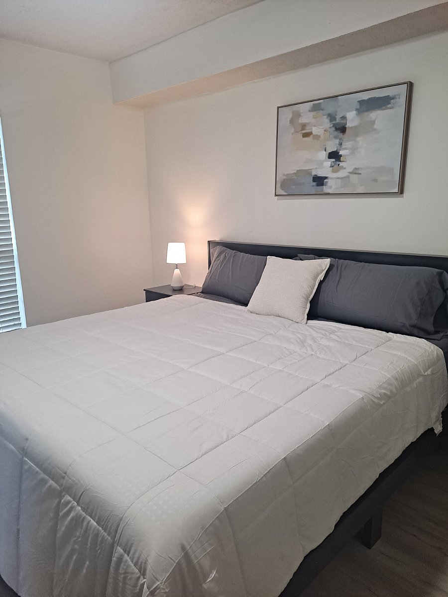 Primary bedroom with king bed, Smart TV, and restful atmosphere