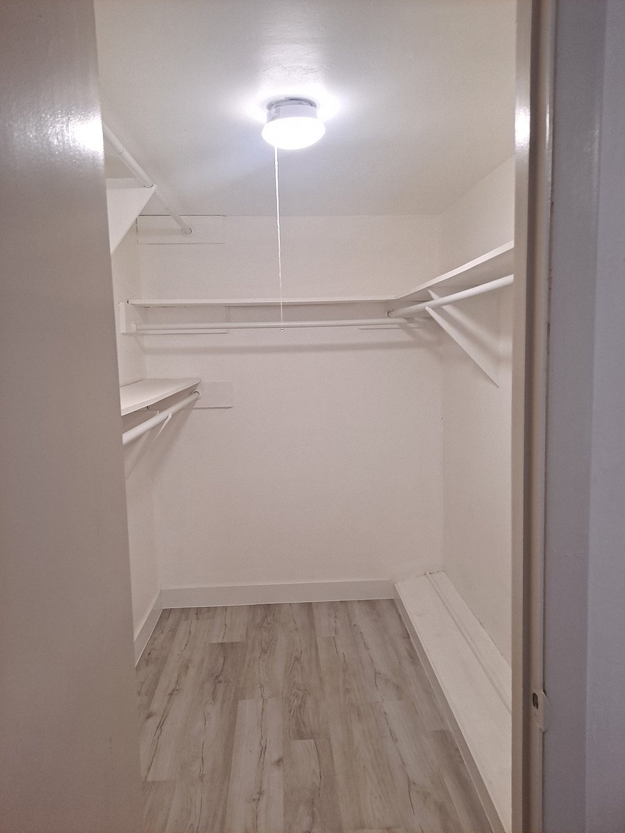 Spacious walk-in closet designed for long stays