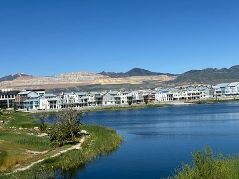 Oquirrh Lake is filled with amenities such as watercraft rentals, trails, beaches, fishing & water taxi.
Only a block away from townhome!