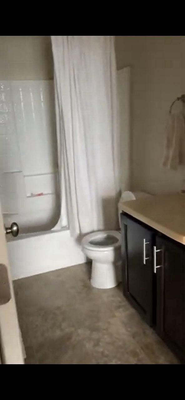 Bedroom 1 full bathroom with storage space