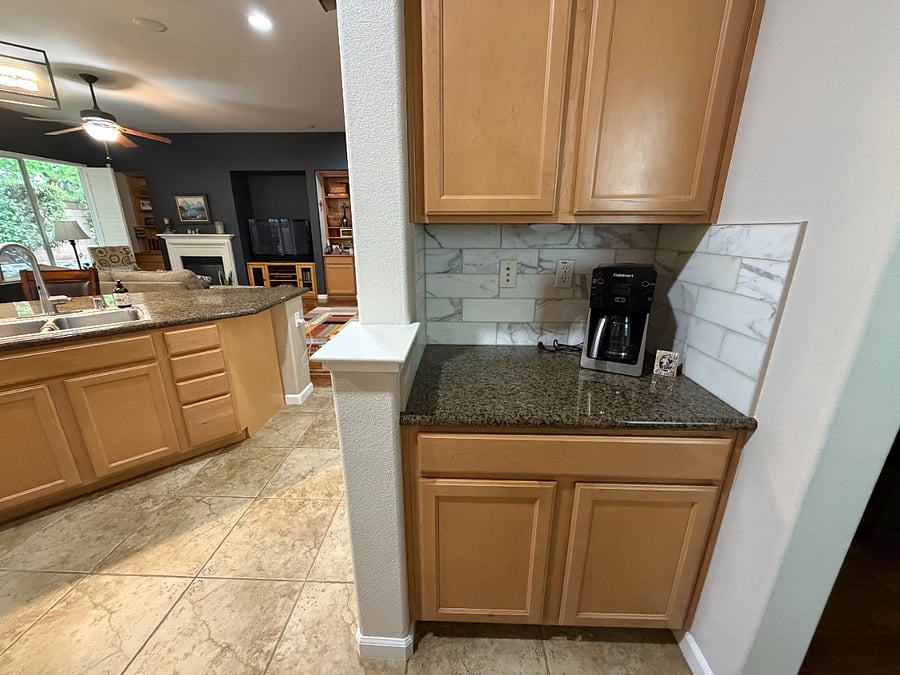 This is the view from the entryway into the garage. It shows the very important coffee maker! It is open, airy, cozy and comfortable.
