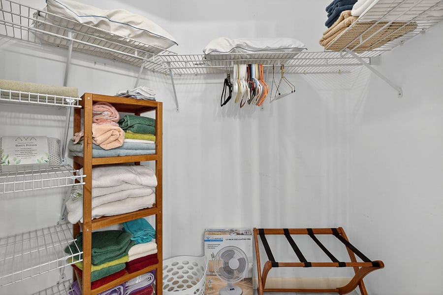 Primary bedroom walk in closet. ( Second bedroom closet not pictured)