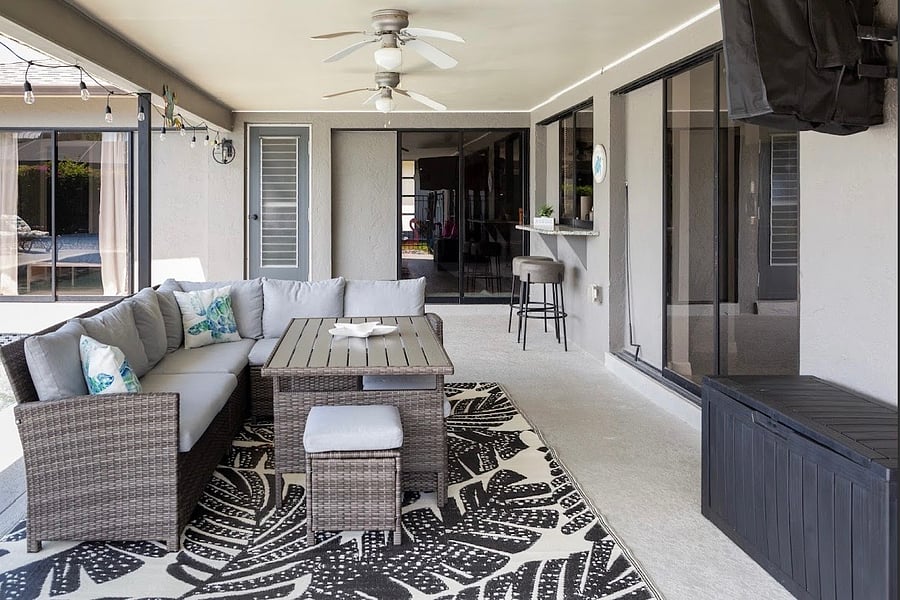 Covered Patio with outdoor dinning and walk up bar, window to kitchen. Smart TV on patio and all the pool essentials.