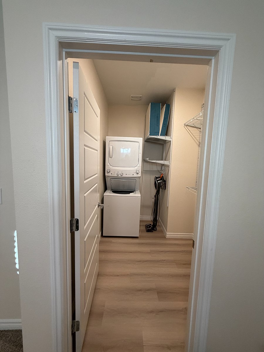 Stacking washer inside walk-in closet