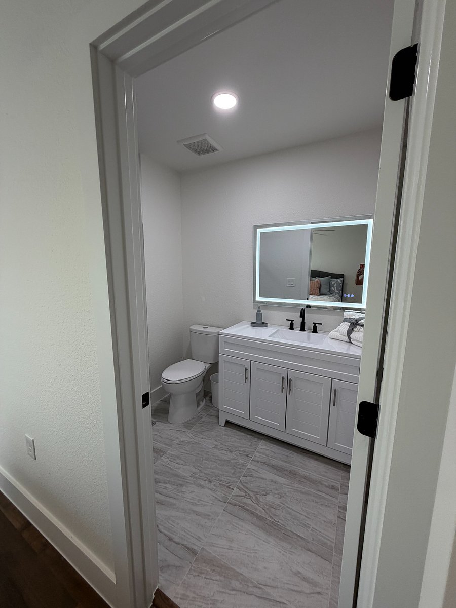 South bedroom bath with LED mirror.