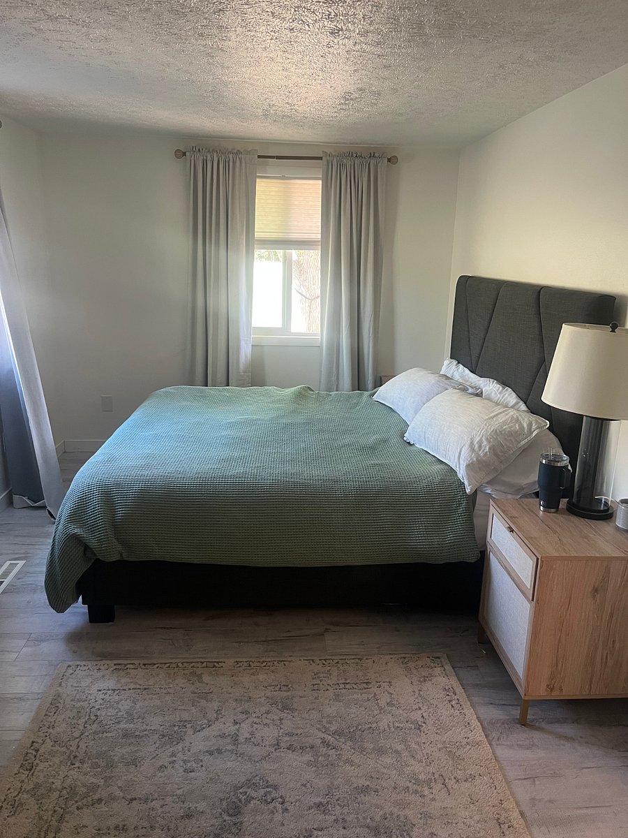King Bed. Curtains are blackout.