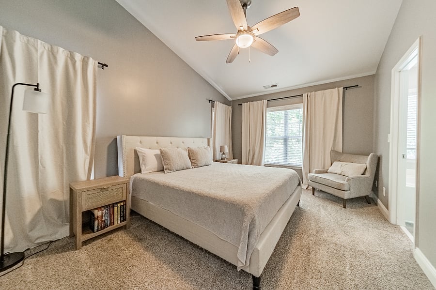 maser bedroom, king bed. black out curtains and ceiling fan