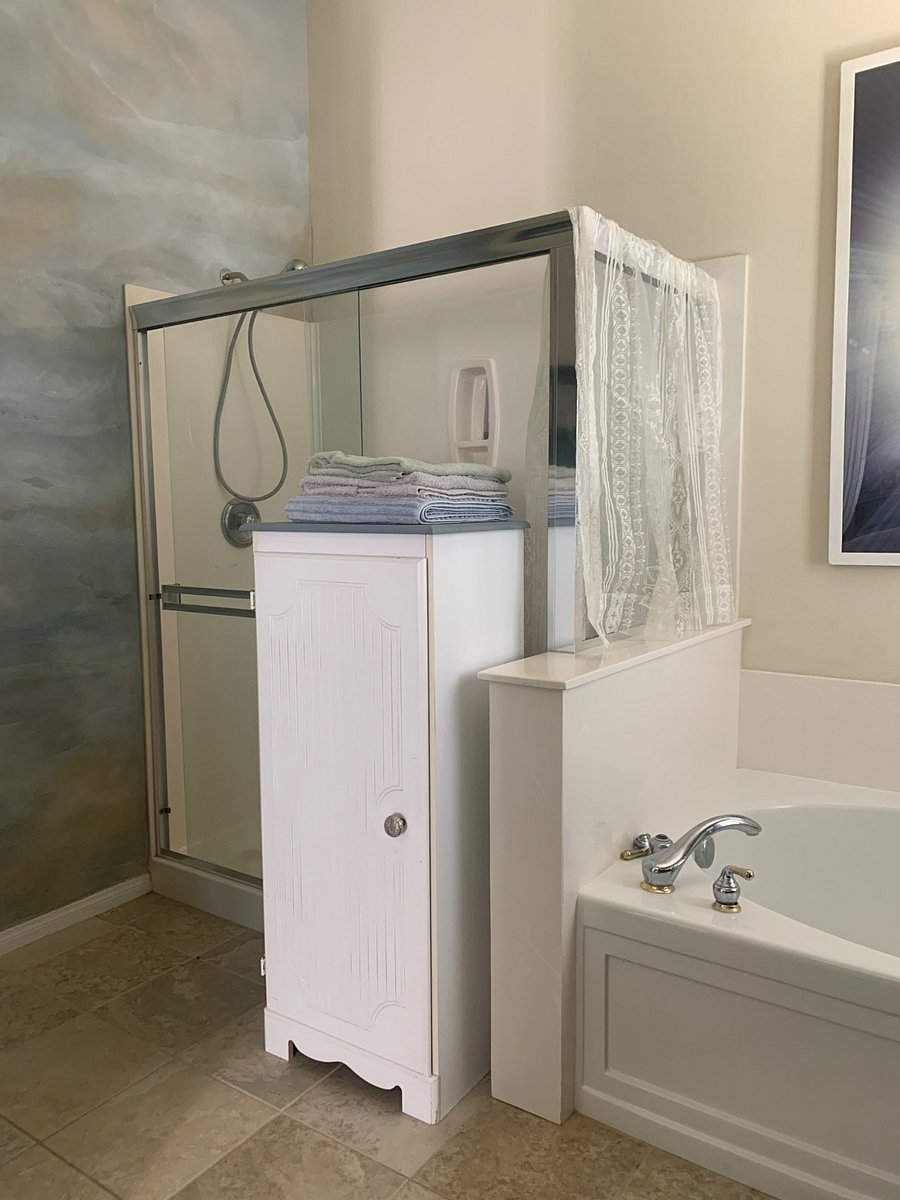 Tub and shower.
Large mirror.