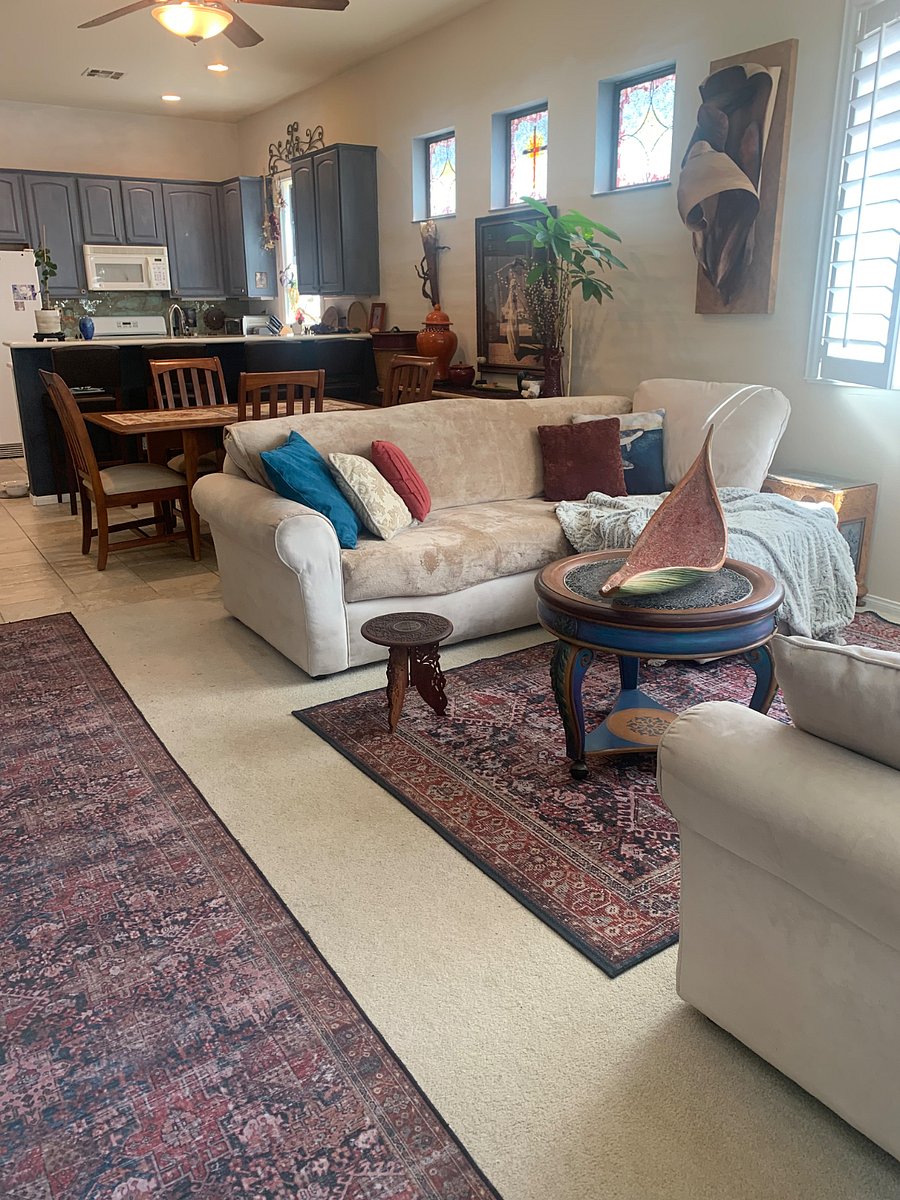 Living rm space open to the kitchen and bar.